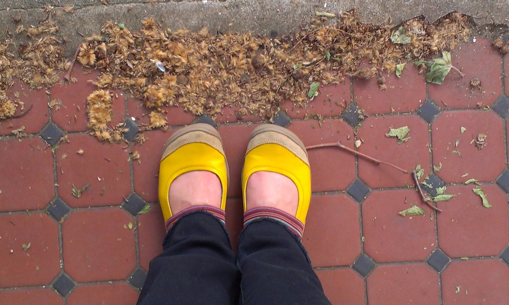 My feet in yellow shoes
